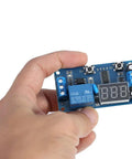12V DC Infinite Cycle Delay Timer Relay With LED Display, On Off Switch Loop Module For DIY Projects, held in hand