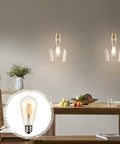 Vintage LED Edison Bulbs ST58 4W 60W Equivalent shown illuminating a cozy dining room with warm amber glow, E26 base visible.