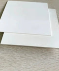 High Purity BN Ceramic Sheet For Heat Sinks And Lab Research, 10mm By 100mm By 100mm, 1 Piece, shown stacked on surface