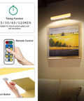 4 Pack Wireless Picture Light With Remote Battery Operated Wall Sconces illuminating framed art on a wall with control features
