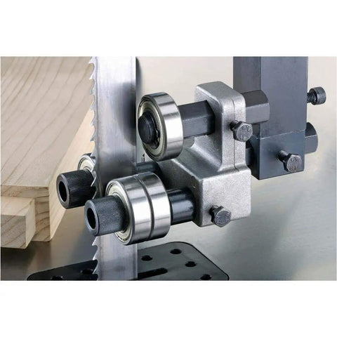 Close-up of ball bearing blade guides on 24 Inch Industrial Bandsaw With 7.5 HP 3 Phase Power Dual 4 Inch Dust Ports Ball Bearing Blade Guides Quick Release Blade Tension Beefy Heavy Duty Build For Rugged Woodworking And Metal Projects