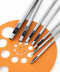 7 Piece Hollow Punch Set With Round Holes From 0.5mm To 5mm For Leather Craft Watch Bands And More shown with leather cutouts