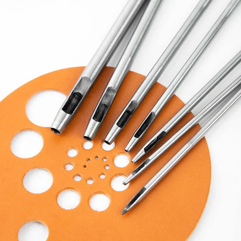 7 Piece Hollow Punch Set With Round Holes From 0.5mm To 5mm For Leather Craft Watch Bands And More shown with leather cutouts