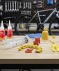 All In One Hydraulic Brake Bleed Kit With 120ml Mineral Oil, funnel, syringes, and adapters for MTB and road disc brakes.