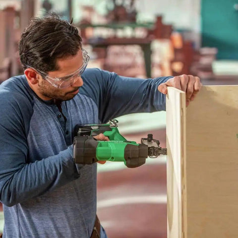 Person using Beast Of A 18V MultiVolt Cordless Stapler Kit With 1/4-Inch Narrow Crown on wooden panel