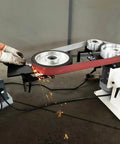 Badass 2X72 Inch Variable Speed Belt Sander And Multi Angle Vertical Horizontal Grinder For Knife Polishing With Three Abrasive Wheels And Rock Solid Base 110V 2840 RPM Shop Staple in action with sparks during grinding.