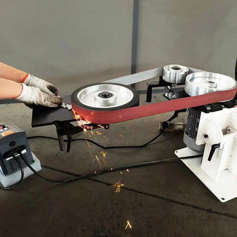 Badass 2X72 Inch Variable Speed Belt Sander And Multi Angle Vertical Horizontal Grinder For Knife Polishing With Three Abrasive Wheels And Rock Solid Base 110V 2840 RPM Shop Staple in action with sparks during grinding.