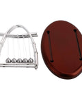 Desktop Pendulum Balance Balls Desk Toy With Steel Frame next to oval base, showcasing classic cradle physics demonstration.