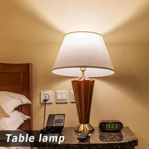 A bedside table lamp with a warm glow using 25 Watt Equivalent A15 E26 LED Bulbs Soft White 2700K Cozy Home Lighting.