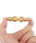 Brass 1/4 Inch Flare Male Adapter And 1/4 Inch Flare Swivel Nut Set Pack Of 6 Durable Fittings For LP Gas And Natural Gas Corrosion Resistant High Temperature Tolerant Premium Brass Construction, two brass flare adapters held in hand