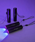4 Pack Rechargeable UV Blacklight Flashlights 365nm And 395nm Mini LED Handheld Torches USB C Charging on display with light beams