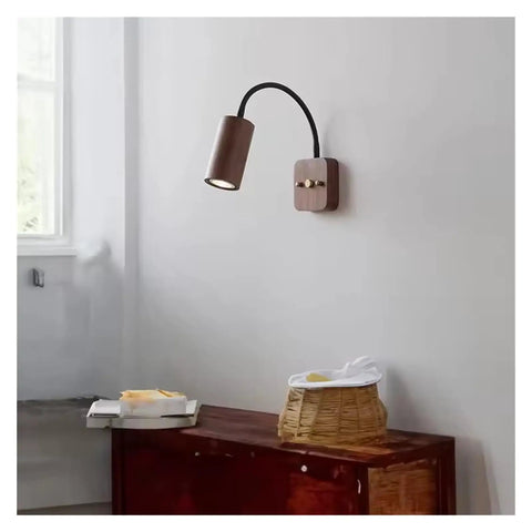 Modern Walnut Wall Sconce With 360 Degree Swivel Spotlight Brings Chill Vibes To Bedrooms And Living Rooms While Delivering Smooth Adjustments For Aisles That Makes Installation A Breeze Today, mounted on a wall.