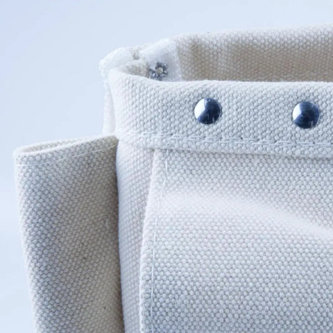 Close-up of Heavy Duty No 4 Canvas Tool Bag With Bull Pin And Bolt Pouch showing riveted seams and double bottom construction.