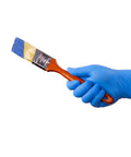 Close-up of blue nitrile disposable glove on hand gripping a wooden paintbrush