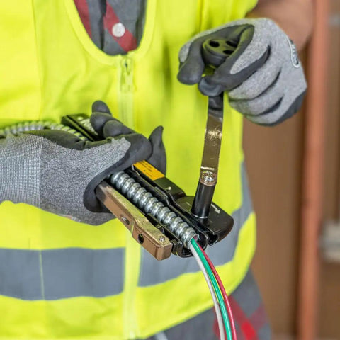 Armored And BX Cable Cutter 53725 That Cuts Up To Three Eighths Inch Armored Cable Including BX AC MC MCAP Greenfield With Storage Case And Extra Blades Adjustable Depth To Prevent Cable Nicks Klein Tools in use.