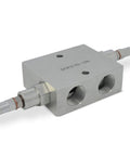 Dual Crossover Hydraulic Relief Cushion Valve With Three Quarter Inch NPT Ports And 30 GPM For Reversible Hydraulic Motors Or Double Acting Cylinders, Delivers Beefed Up Surge And Shock Protection To Minimize Overloads In Hydraulic Circuits. Silver hydraulic valve block with threaded ports