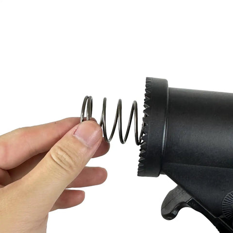 Hand inserting spring into black Bike Repair Stand Replacement Plastic Parts YC-100ST-W For YC-100ST And YC-100BH Black Upgrade Kit
