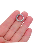 Premium Industrial Heavy Duty Split Lock Washers M10 bright silver stainless steel shown in hand for bolts and screws.