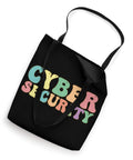 Slick Cyber Security Tote Bag Built Tough With Heavy Duty Canvas And Reinforced Strap Handles, A Dope Daily Grind Essential For It Workers And Code Masters Who Dig Secure Gear, black tote with colorful 'CYBER SECURITY' text.