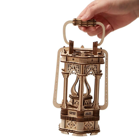 Dope Wooden Puzzle Lantern With LED Light for Adults and Teens held by hand, showcasing intricate wood design, vintage DIY kit.