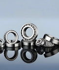 Various sizes of tapered roller bearings on display, including Beefy Heavy Duty Tapered Roller Bearing Model 02872 02820, made of GCr15 steel.