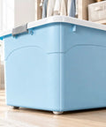 Hassle Free Stackable Storage Bins With Slick Rolling Wheels And Secure Tight Fitting Lids Tailored For Crunching Clutter Closets Dorm Rooms And Garage Use, blue plastic storage bin in a closet.