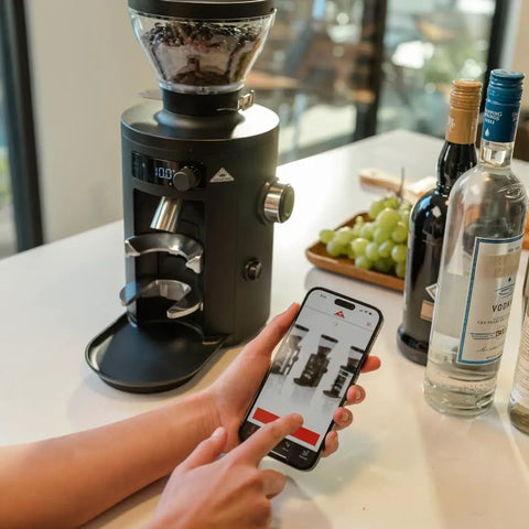 Barista Level Electric Coffee Grinder With Stepless Control And 54Mm Steel Flat Burrs delivers consistent grounds next to a smartphone app.