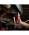 Knuckle Buster Cordless Right Angle Impact Wrench Featuring Dual Speed Drive Control Anvil used for automotive repair under vehicle.