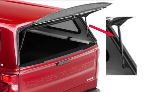 No Fuss 12 Inch Gas Strut Lift Kit For Camper Shells mounted on a red truck cap, showcasing the gas strut mechanism and lid support.