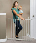 Woman holding toddler by Essential Stairway and Walkway Baby Gate for Stairs and Doorways, Hardware Mounted, 30 Inch Tall, White with Safe Latch