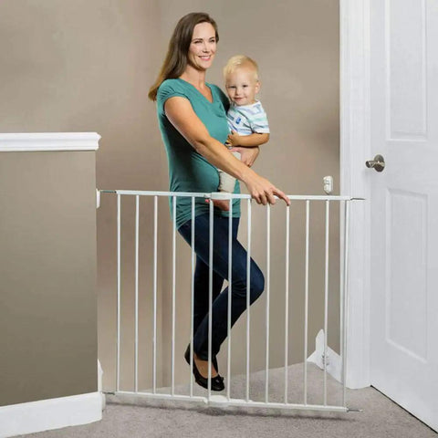 Woman holding toddler by Essential Stairway and Walkway Baby Gate for Stairs and Doorways, Hardware Mounted, 30 Inch Tall, White with Safe Latch