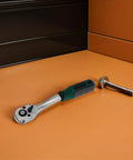 Heavy Duty 10mm Quick Release Ratchet Extension Featuring 72 Tooth Reversible Head For Mechanics Seeking Straight Fire Torque And Slick As Butter Movement In Tight Garage Spots on orange surface next to a bolt.