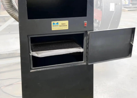 Kickass Dust Collection System For Eight Inch Angle Grinders featuring a black cabinet with an open door exposing filter.