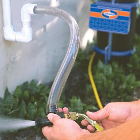Hands using Nitrogen Sludge Sucker And Blaster Kit With Metal Carrying Stand For 40 Cubic Feet Tank Pro HVACR Gear Featuring 400 PSI Regulator Protective Boots Copper Line Purge Tank Not Included to spray water through hose