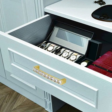 Open drawer with Gold U Shape Crystal Glass Cabinet Knobs Set installed, sparkling pull on a dresser, showcasing its elegance and style.