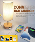 Round Fabric Shade Bedside Lamp With USB Ports And Touch Control 3 Way Dimmable Nightstand Light For Bedroom Living Room Dorm Or Home Office Corded Electric No Battery Fast Charge Phones And Tablets While You Sleep, showcasing USB charging function with phone and tablet connected.