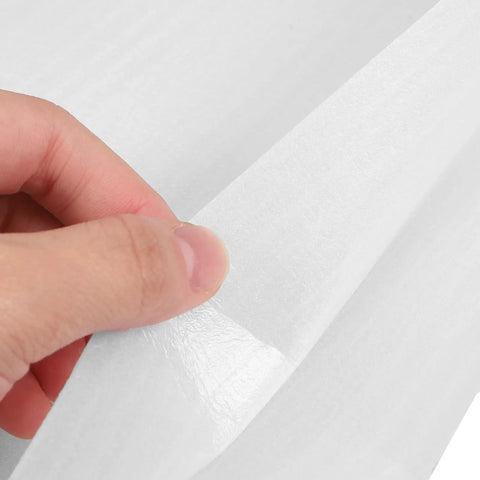 Foam Pouch Cushioning for Fragile Items 100 Pack White being held, showing shock-resistant and durable material for safe transit