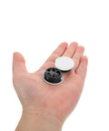 Durable Round Pin Buckle Sectional Furniture Connectors, easy installation, secure PP material, shown on an open hand.
