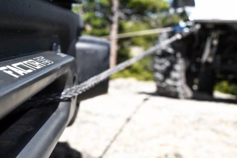 Close-up of Beefy Winch Hubs And Hawse Fairlead Kit 1.0 Inch Thick Heavy Duty Recovery Gear in use on off-road Jeep