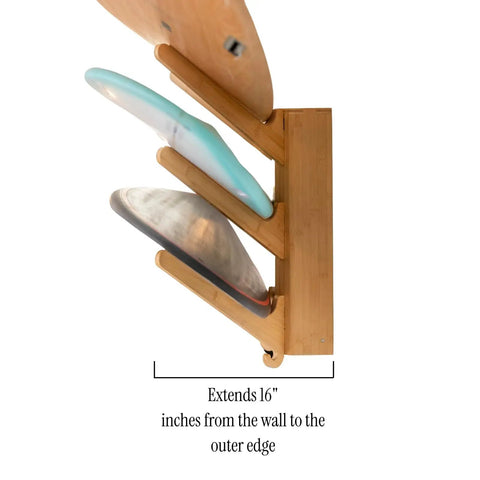 Side view of The Sun Rack Premium Bamboo Wall Mount For Surfboards Snowboards Skis And Wakeboards Holds Four Boards With Built In Drawer And Hooks For Garage And Home Storage Dope Space Saving Display And Organization, showing three boards secured.