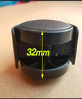 Front view of black plastic heater wheel, 32mm diameter, replacement caster for electrical oil heaters.