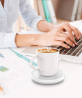 Smart Automatic Mug Warmer With Gravity Induction For Coffee And Tea Keeps Beverages Smooth And Hot All Day office desk scene with steaming coffee mug.