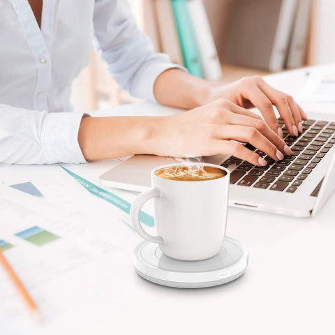 Smart Automatic Mug Warmer With Gravity Induction For Coffee And Tea Keeps Beverages Smooth And Hot All Day office desk scene with steaming coffee mug.