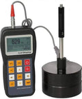 Portable Hardness Tester Handheld On The Go With Built In Printer Color Display And 600 Data Memory Measures Steel Cast Iron Alloy Tool Steel Aluminum Brass Copper Ductile Iron And Forged Steel On Seven Hardness Scales device with cables and digital screen displayed.