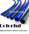 Colorful silicone vacuum hose tubing in blue and black on white background
