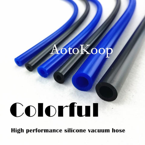 Colorful silicone vacuum hose tubing in blue and black on white background