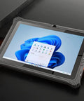 Tough As Nails Rugged Windows Tablet Featuring A Slick 12.2 Inch HD Touchscreen on dark surface with glowing line.
