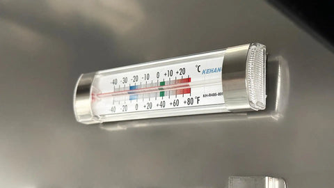 Thermometer on Commercial Buffet Cold Table Refrigerator for accurate temperature monitoring, crucial for food safety.