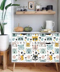 Slick Pastel Woodland Peel And Stick Wallpaper With Cute Animal Head Prints on dresser, perfect for cozy playrooms and bedrooms.