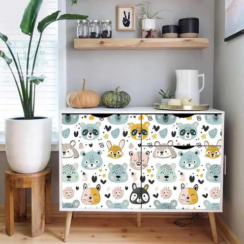 Slick Pastel Woodland Peel And Stick Wallpaper With Cute Animal Head Prints on dresser, perfect for cozy playrooms and bedrooms.